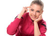 smiling teenager girl in a tracksuit points a finger at her head