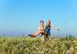 Photo: The happy young pair in the field of chamomiles. The happy young pair in the field of chamomiles.