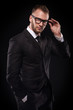 businessmanman in black suit and glasses