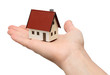 Hand holding a new house. Isolated over white background