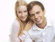 Photo: Portrait of a happy couple sitting together Portrait of a happy couple sitting together