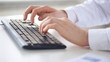 male doctor hands typing on keyboard
