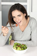 beautiful young girl eating healthy food