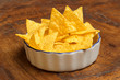 bowl of tortilla chips on wooden background