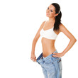 Funny woman shows her weight loss by wearing an old jeans, isola