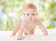 Cute baby with beautiful blue eyes on the nature background