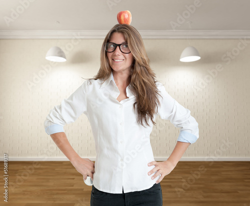 Photo: Woman with apple on her head Woman with apple on her head