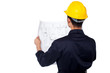 Civil engineer reviewing blueprint