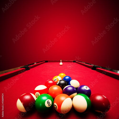 Photo: Billards pool game. Color balls in triangle, aiming at cue ball Billards pool game. Color balls in triangle, aiming at cue ball