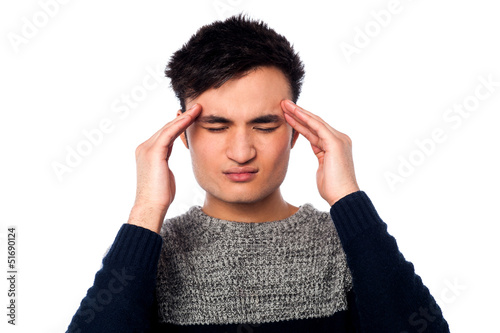 Photo: Young guy having headache Young guy having headache