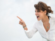 Surprised woman pointing