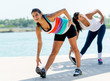 Women stretching outdoors