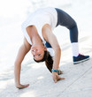 Flexible woman stretching back