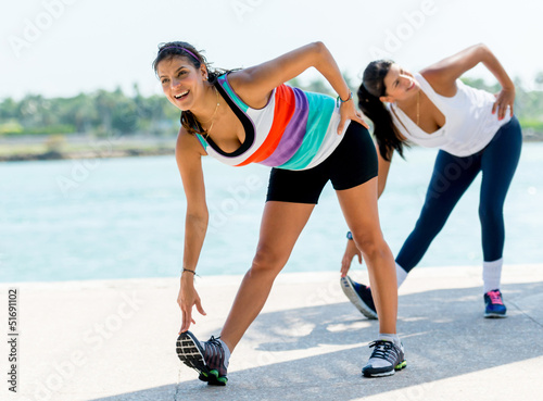Photo: Women stretching outdoors Women stretching outdoors