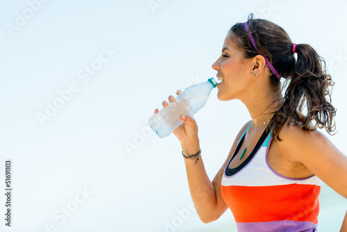 Photo: Fit woman drinking water Fit woman drinking water