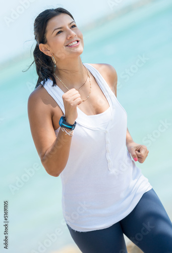 Photo: Woman running outdoors Woman running outdoors