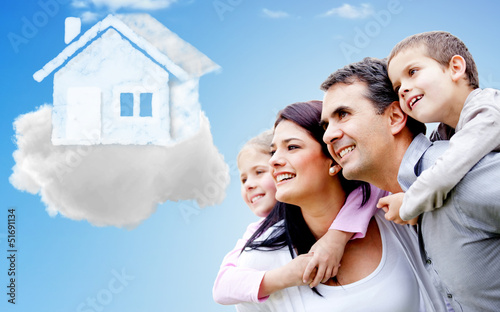 Photo: Family thinking of their dream house Family thinking of their dream house