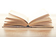 open vintage book on woodenbackground