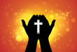 Person offering prayer or worshiping with cross in hand