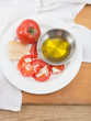 Photo: Plate of vine ripened red tomato with parmesan and olive oil Plate of vine ripened red tomato with parmesan and olive oil