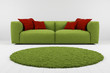 Green sofa with carpet closeup