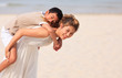 Mom and son play on beach