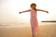 Asian woman walk on beach