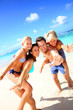 Family of four having fun at the beach