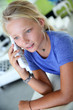 Teenaged girl talking on the phone