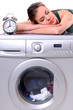 woman sleeping on a washing machine
