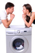 beautiful young couple with a washing machine
