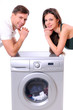 beautiful young couple with a washing machine