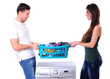 beautiful young couple with a washing machine