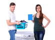 beautiful young couple with a washing machine