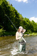 Photo: woman fishing in river, Czech Republic woman fishing in river, Czech Republic