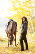 Photo: equestrian with her horse in autumnal nature equestrian with her horse in autumnal nature