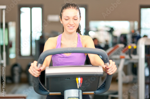 Photo: Woman running on a treadmill Woman running on a treadmill