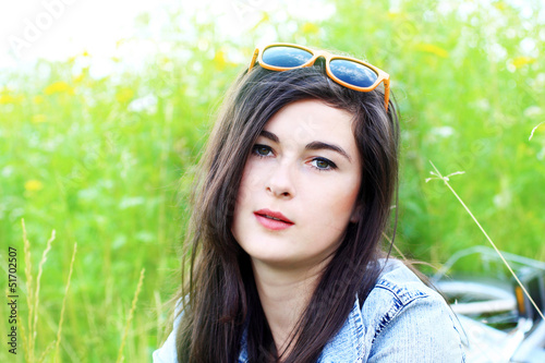 Photo: Beautiful young woman in summer fields Beautiful young woman in summer fields