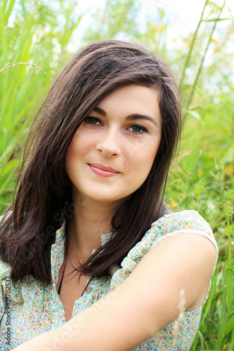Photo: Beautiful young girl in summer fields Beautiful young girl in summer fields