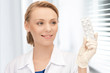attractive female doctor with pills