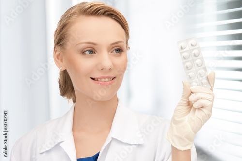 Photo: attractive female doctor with pills attractive female doctor with pills