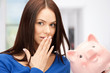 lovely woman with piggy bank