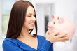 lovely woman with piggy bank
