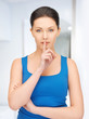 woman making a hush gesture
