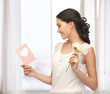 young woman holding flower and postcard