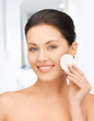 beautiful woman with cotton pad