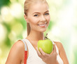 sporty woman with apple and measuring tape