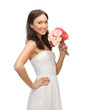 woman smelling bouquet of flowers