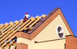 Carpenter man working on the new roof