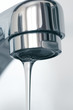 Water flowing from water faucet, close up